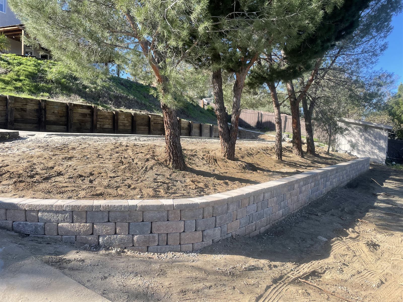 Custom stone retaining wall built by Collier Landscaping in San Diego