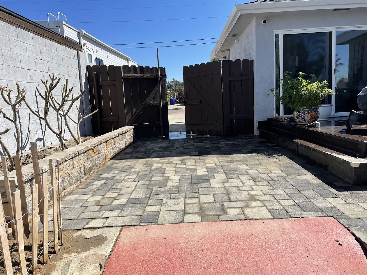 Paver walkway leading to the side gate in a La Mesa backyard hardscape project